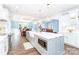 Open concept kitchen with island, farm sink, and views to the living area at 5164 Green Rd, Stanley, NC 28164