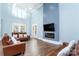 Open living space featuring hardwood floors, fireplace and high ceilings at 5164 Green Rd, Stanley, NC 28164