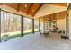 Covered patio with wood ceilings, ceiling fan, and plenty of space at 5164 Green Rd, Stanley, NC 28164