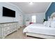 Spacious primary bedroom with large bed, dresser, and vaulted ceilings at 6110 Paw Village Rd, Charlotte, NC 28214