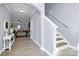 Bright entryway with tile flooring, an arched doorway, and a white console table at 6110 Paw Village Rd, Charlotte, NC 28214