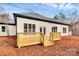 Rear view of house showcasing deck and backyard at 6701 Pleasant Grove Rd, Waxhaw, NC 28173