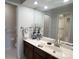 Bathroom features a vanity with a large mirror, and a bathtub shower at 7428 Ashfield Ct, Charlotte, NC 28226