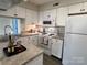 Modern kitchen with white cabinets and ample counter space at 7428 Ashfield Ct, Charlotte, NC 28226