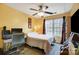 Bedroom with a double bed, ceiling fan, and workspace at 9149 Washam Potts Rd, Cornelius, NC 28031