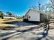 Rear view of the house with a detached shed at 99 Locust St, Great Falls, SC 29055