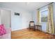 Bedroom with hardwood floors, rocking chair, and double closet at 1008 Candlewood Ln, Rock Hill, SC 29730