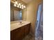 Bathroom with vanity, sink, and shower/tub combo at 10457 Stokeshill Ct, Pineville, NC 28134