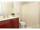 Clean bathroom with a shower/tub combo and updated vanity at 11015 Alderbrook Ln, Charlotte, NC 28270