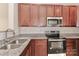 Kitchen with stainless steel appliances and granite countertops at 11121 Kanturk Ct, Charlotte, NC 28213