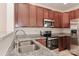 Kitchen boasts stainless steel appliances and granite countertops at 11121 Kanturk Ct, Charlotte, NC 28213