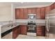 Kitchen with stainless steel appliances and granite countertops at 11121 Kanturk Ct, Charlotte, NC 28213