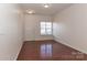 Living room with hardwood floors and neutral walls at 11121 Kanturk Ct, Charlotte, NC 28213