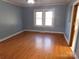 Bedroom with hardwood floors and two windows at 118 Emanuel Church Rd, Rockwell, NC 28138