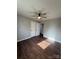 Spacious bedroom with hardwood floors and ceiling fan at 129 Mapleleaf Rd, Statesville, NC 28625