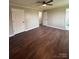 Bright bedroom featuring hardwood floors and double door closet at 129 Mapleleaf Rd, Statesville, NC 28625