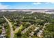 Aerial view of houses near a lake at 19830 Madison Village Dr # 65, Cornelius, NC 28031