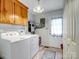 Bright laundry room, featuring washer, dryer, and ample storage at 2430 Lazy Oak Dr, Lancaster, SC 29720