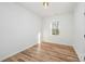 Bright bedroom with wood-look floors and a window at 2503 Parnell Dr, Shelby, NC 28150