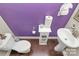 Small powder room with purple walls, pedestal sink, and white toilet at 4146 La Crema Dr, Charlotte, NC 28214