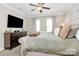 Spacious primary bedroom with large bed, dresser, and plenty of natural light at 4146 La Crema Dr, Charlotte, NC 28214