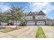 Three-story townhome with attractive facade at 4146 La Crema Dr, Charlotte, NC 28214