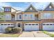 Three-story townhome with a neutral color palette and attached garages at 4146 La Crema Dr, Charlotte, NC 28214