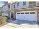 Townhouse with two-car garage and stone accents at 4146 La Crema Dr, Charlotte, NC 28214