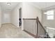 Upstairs hallway with carpet and access to bedrooms at 4146 La Crema Dr, Charlotte, NC 28214