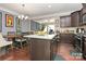 Eat-in kitchen with granite island, stainless steel appliances, and hardwood floors at 4146 La Crema Dr, Charlotte, NC 28214