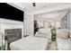 Bright living room with fireplace and views into the kitchen and dining area at 4146 La Crema Dr, Charlotte, NC 28214