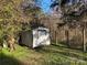 White metal storage shed in yard at 4220 Woodleaf Rd, Salisbury, NC 28147