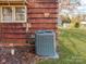 Home exterior showcasing wood siding and AC unit at 491 Lytton St, Troutman, NC 28166