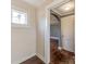 A hallway with an arched doorway leading to another room at 491 Lytton St, Troutman, NC 28166