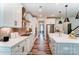 Modern kitchen with island, stainless steel appliances, and white cabinetry at 5238 Verona Rd # 78, Charlotte, NC 28213