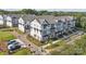 Aerial view of townhouses with landscaped grounds and parking at 703 Hoke Ln, Davidson, NC 28036