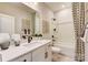 Clean bathroom with bathtub, shower, and updated vanity at 703 Hoke Ln, Davidson, NC 28036