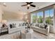 Bright living room with large windows and comfortable seating at 703 Hoke Ln, Davidson, NC 28036