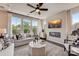 Spacious living room with a modern fireplace and large windows at 703 Hoke Ln, Davidson, NC 28036