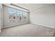 Bright bedroom with carpeted floors and large windows at 711 Hoke Ln, Davidson, NC 28036