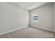 Bright bedroom with window and neutral decor at 711 Hoke Ln, Davidson, NC 28036