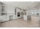 Modern kitchen with island, stainless steel appliances, and ample cabinet space at 711 Hoke Ln, Davidson, NC 28036