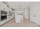 Bright kitchen with white cabinets, stainless steel appliances, and an island at 711 Hoke Ln, Davidson, NC 28036