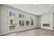 Spacious living room with fireplace, hardwood floors, and sliding glass door to patio at 711 Hoke Ln, Davidson, NC 28036