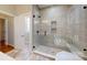 Modern bathroom with large glass shower, tile walls, and ample light at 8046 Lucky Creek Ln, Denver, NC 28037