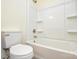 White and clean bathroom with shower, toilet, and built-in shelving at 9709 Calpher Ct, Matthews, NC 28105