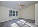 Large bedroom with vaulted ceiling, carpeted floors, and bright windows at 9709 Calpher Ct, Matthews, NC 28105