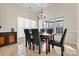 Bright dining room with large windows and six-chair table at 10302 Sawtimber Ct, Huntersville, NC 28078