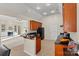 Kitchen features a breakfast bar, dark wood cabinets and granite countertops at 10302 Sawtimber Ct, Huntersville, NC 28078