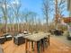 Relaxing deck with seating area, dining furniture and wooded views at 10827 Hadrians Walk Ct, Mint Hill, NC 28227